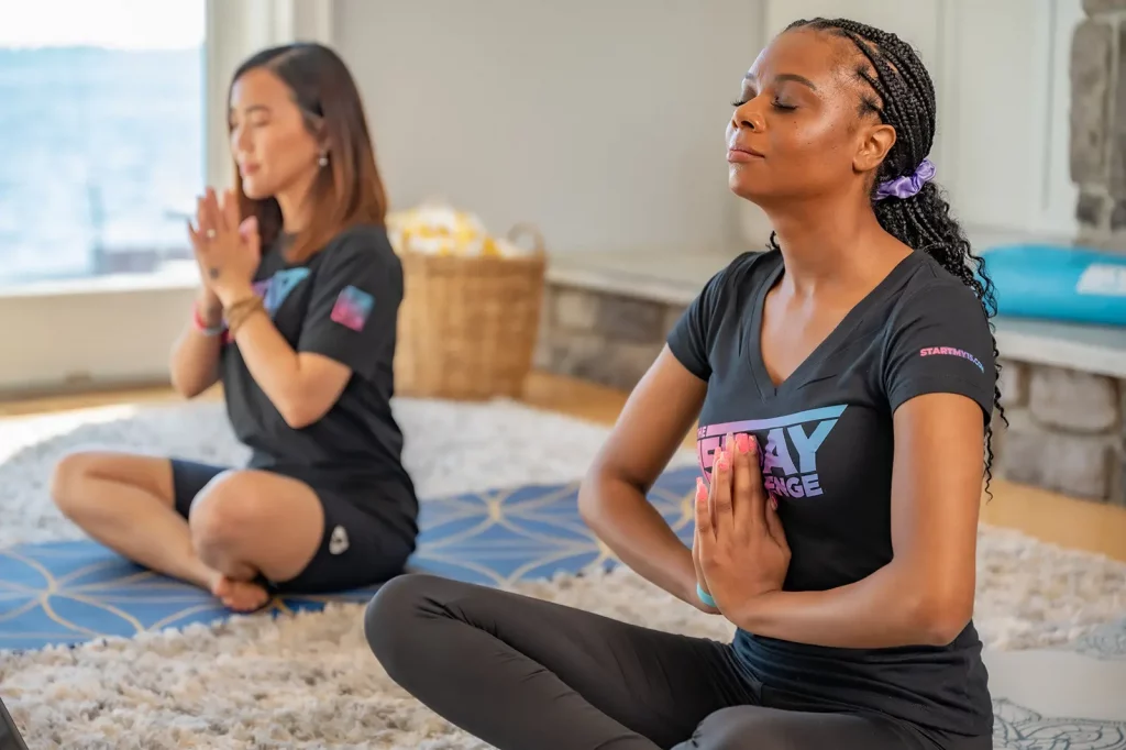 Two women doing yoga together